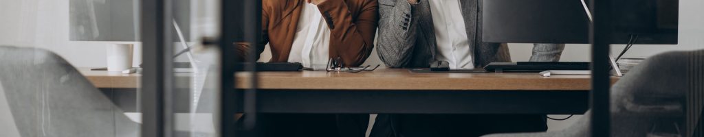 two-business-partners-working-together-office